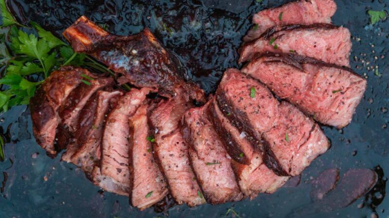 Smoked cowboy steak, sliced